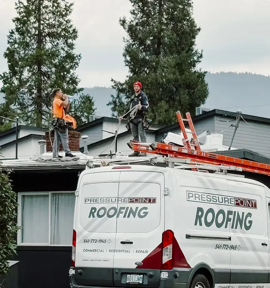 Pressure Point Roofing crew working on a residential roof in Southern Oregon