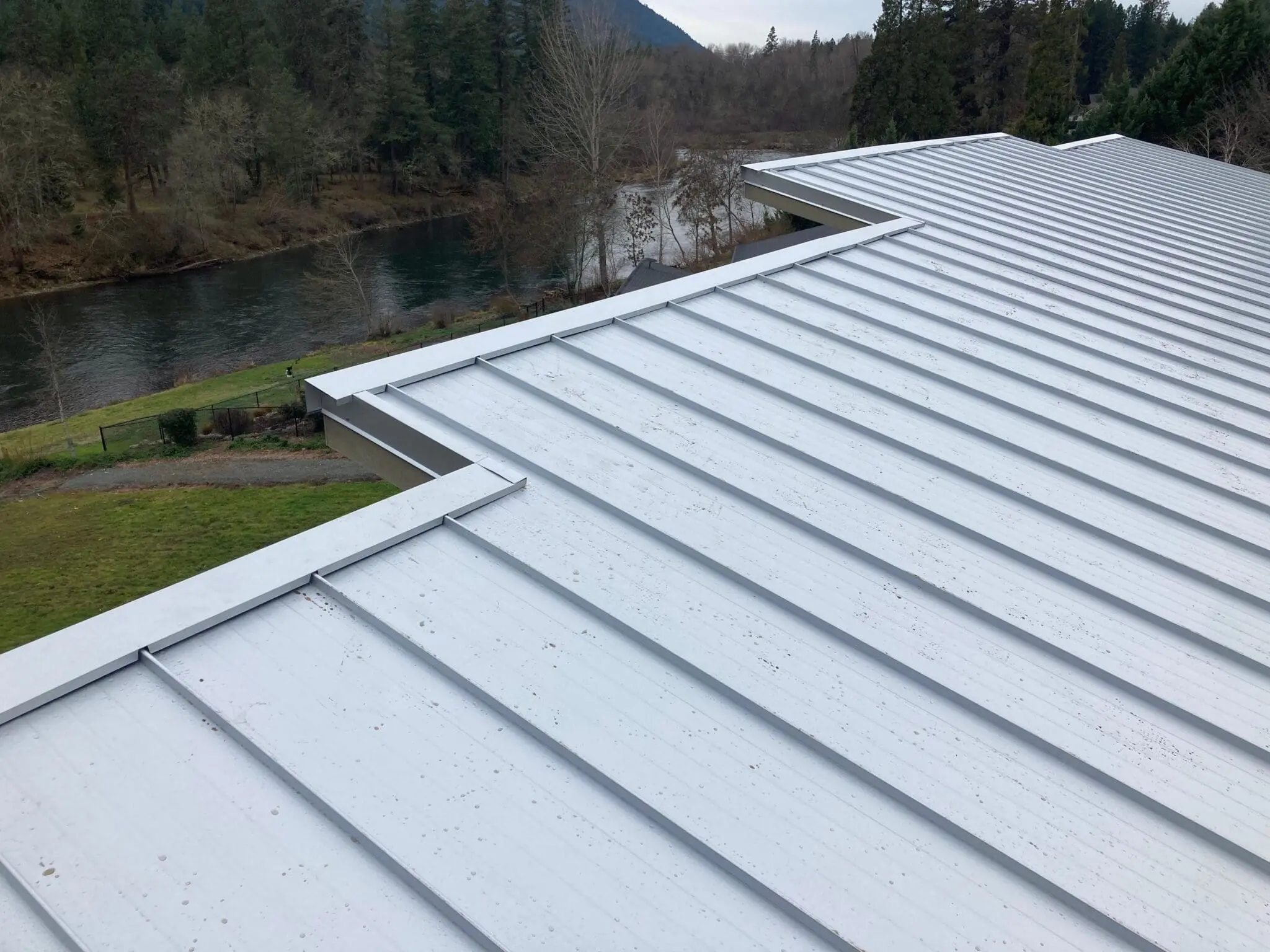 New Taylor Metal streamline zincalume metal roof installed on a river house